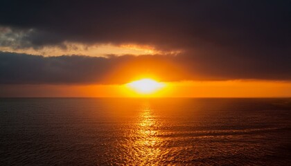 A big sun rises under the dark sky