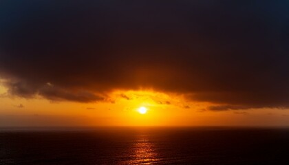 Fototapeta premium A big sun rises under the dark sky