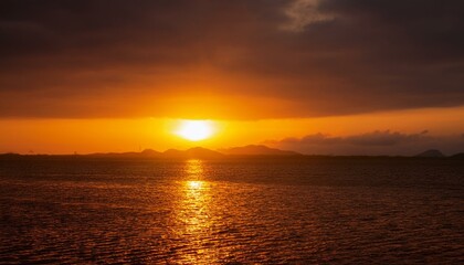 A big sun rises under the dark sky