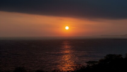Fototapeta premium A big sun rises under the dark sky