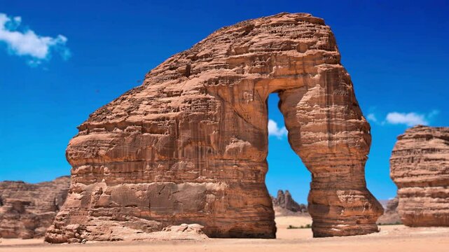Timelapse of Elephant Rock, Al Ula, Saudi Arabia. Unesco World Heritage site, a landscape of sand, rocks Near to Hegra and a main tourist attraction. Elephant Rock (Jabal AlFil) in Al Ula Saudi Arabia