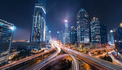 Obraz premium Night aerial view of modern infrastructure buildings residential city