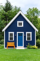 Obraz premium Blue House with Orange Bench and Green Lawn
