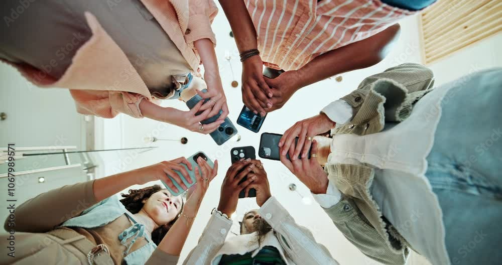 Poster Hands, group and phone with low angle in office with search, project and connection with mobile app. People, men and women with smartphone, circle and teamwork with social media at creative agency