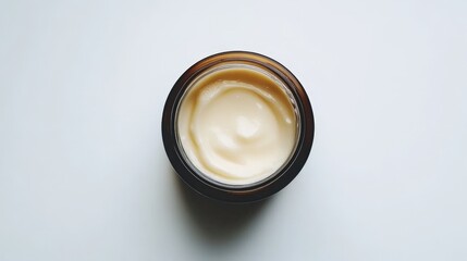 A deep conditioning hair mask in a round jar, isolated on a white background