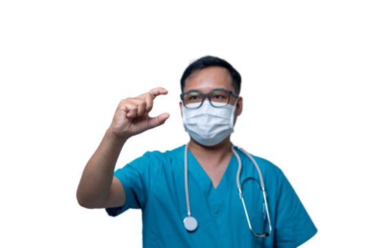 A doctor in a blue scrubs is wearing a mask and holding a pill in his hand. transparent background png