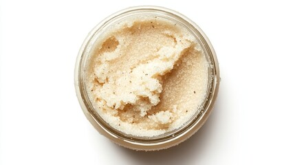 A round jar of exfoliating sugar scrub with natural ingredients, isolated on a white background