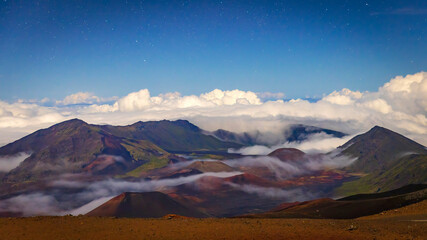 Landscape view at night with stars at the top of Haleakala National Park in Hawaii. © Patrick