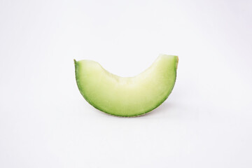 Green cantaloupe melon with cut slice isolated on white background, green melon