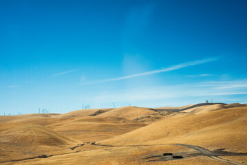 natural panorama of california desert with electric antennas on the horizon
