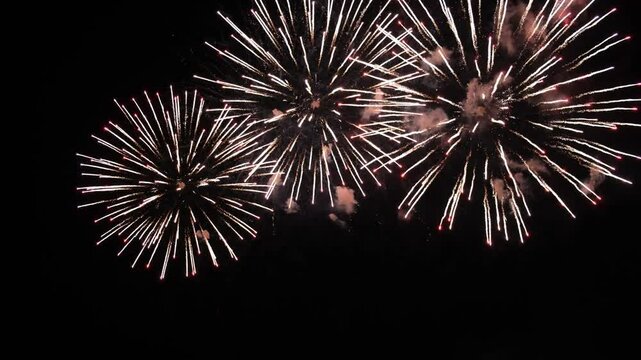 4K colorful fireworks in the night sky. Colorful pyrotechnic show right above your head. Magic and fairy tale on new year's eve. Festival, wedding, Happy Birthday, Christmas, Diwali, New year