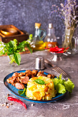 boiled rice with fried meat on plate
