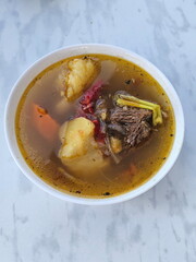 Khashlama in a white ceramic bowl