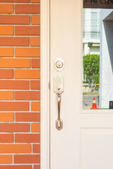 White front door with Red brick wall texture background,modern house in city,japan or korea home,Old brick blocks wall,copy space, brickwork exterior mockup.