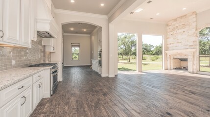 Spacious modern kitchen and living area with natural light and outdoor view.