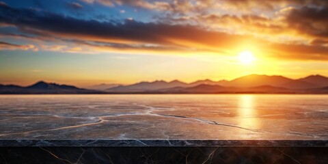 Obraz premium A Polished Marble Countertop Overlooks a Mountain Range Bathed in the Golden Hues of a Setting Sun