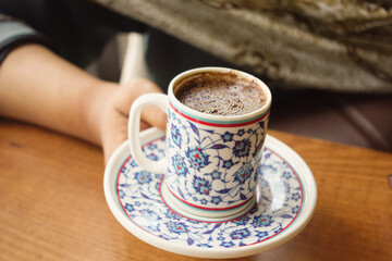 woman drinking turkish coffee at cafe 