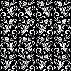 Flower pattern. Seamless white and black ornament. Graphic vector background. Ornament for fabric, wallpaper, packaging.