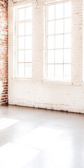 Bright and airy interior with large windows and exposed brick in a modern space