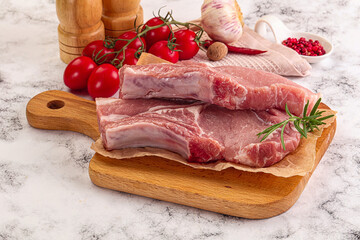 Raw potk loin steak with bone