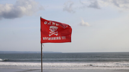 Danger No Swimming warning sign Red Flag on the Indian Ocean Beach 
