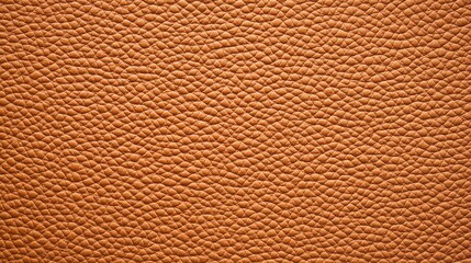 Fototapeta premium A close-up view of textured brown leather, showcasing its rich color and intricate patterns, ideal for crafting and design.