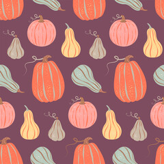 Colorful pumpkins seamless pattern on purple background. Vector illustration in a vintage retro style. Thanksgiving, harvest, autumn season fabric textile, packaging, wrapping paper, wallpaper design