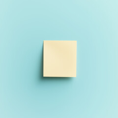 Fototapeta premium Minimalist yellow sticky note on a pale blue background, symbolizing organization, reminders, and simplicity. Great for productivity and office themes.
