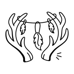 A doodle icon of deer horns adorned with feathers and beads

