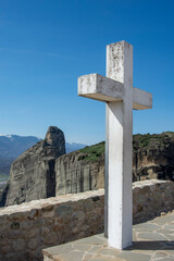holy cross at meteora greece with mountains at the background