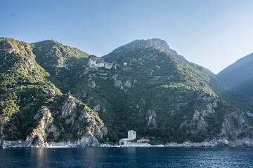 orthodox christian monastery sits on mountain side of mount athos