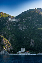 Fototapeta premium orthodox christian monastery sits on mountain side of mount athos
