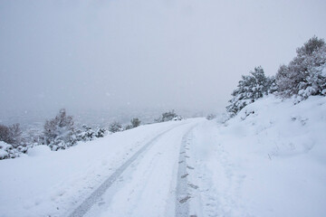 road at mountain in Athens covered by snow