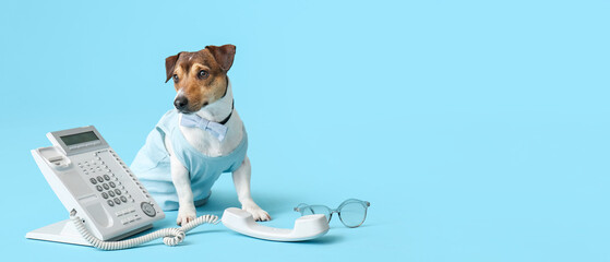 Business dog with telephone on color background