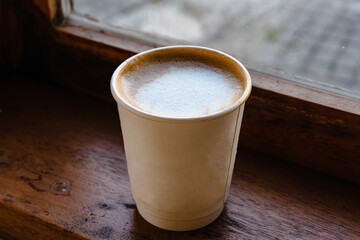 Paper cup Coffee take-away, High Angle View. Wooden table and place for text.table and place for text.