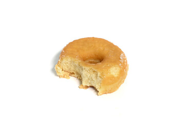 Close-up of a bitten donut isolated on white background