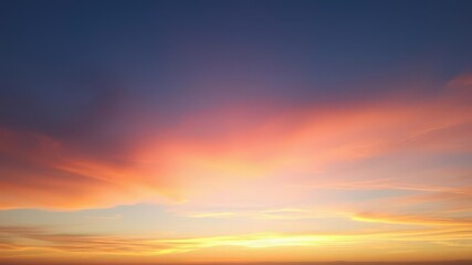 Obraz premium Pastel hues in the sky as fluffy clouds drift across the horizon during a stunning sunset, sky, colorful