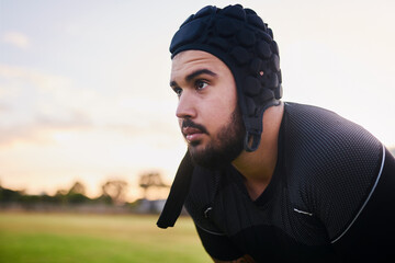 Man, rugby player and ready for outdoor, sports or competition with exercise or fitness. Male person, athlete and recreation facility in scrum cap for match, game and training in stadium for wellness