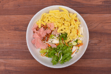 Vegetable salad or pickles are typical Indonesian food, with a very delicious peanut sauce.