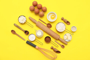 Different ingredients for preparing sweet cinnamon roll on yellow background