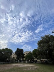 Historic buildings under a vibrant blue sky with clouds