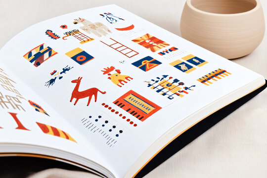 a graphic designer's sketch book with several isotype designs