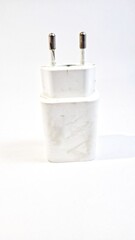 Isolated of used cell phone charger adapter with white background. used to charge the device.