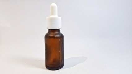 Isolated of cosmetic liquid bottle white color background. Liquid bottle for skin care or acne prevention. 