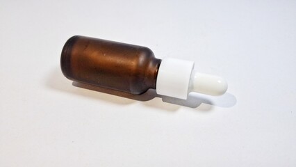 Isolated of cosmetic liquid bottle white color background. Liquid bottle for skin care or acne prevention. 