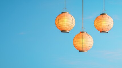 Obraz premium Glowing Lanterns Hanging from Strings for a Festive Evening