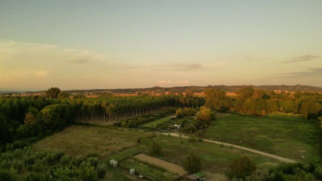 A cinematic drone view during sunset of the motherland to the classic scooter. 15 minutes to Pisa 30 minutes to Florence.