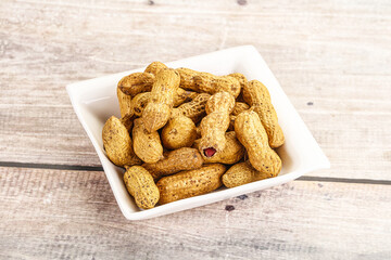 Raw ripe unpeeled peanut heap