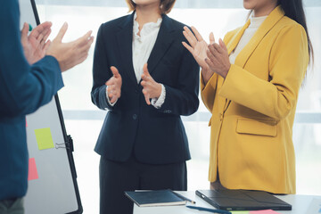 Applauding Success: Businesswomen Appreciative of Presentation 