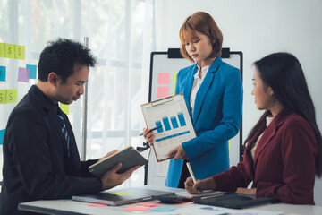 Business Meeting Presentation: A focused team collaborates during a productive meeting, reviewing key data and strategizing for success. The image exudes professionalism and teamwork. 